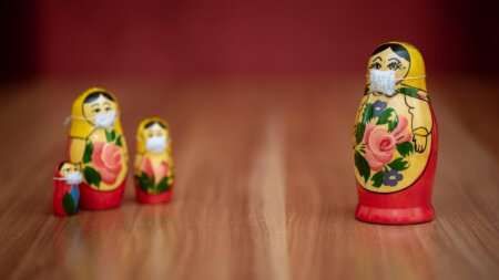 Russian dolls wearing face masks