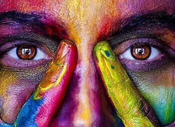 Eyes peering out from a painted face body image